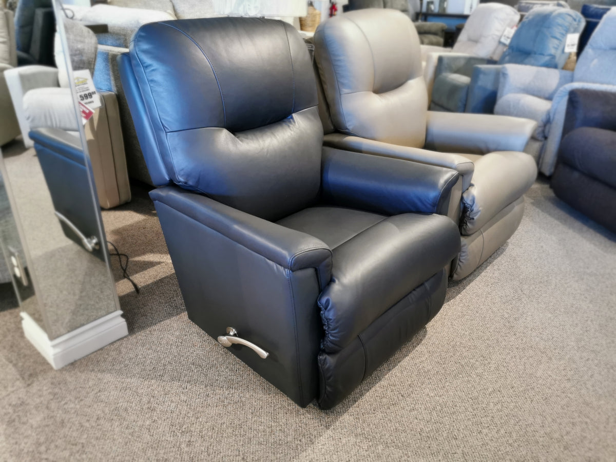 The La-Z-Boy 783 Aries Rocker Recliner is displayed in the furniture store showroom next to a mirror, offering both comfort and durability.