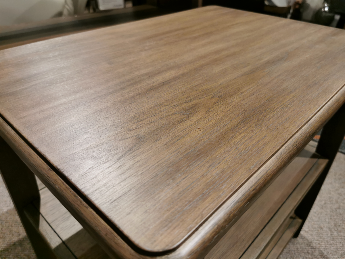 Close-up of Magnussen's Corden T5695-03 table surface with wallaby finish and subtle wood grain pattern.