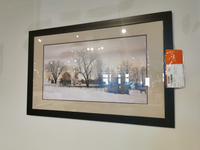 Framed painting titled 'Outside Of Bally' by Picture Depot, showcasing a winter landscape with bare trees and a snowy field, elegantly encased in a Glass Art Frame, mounted on an indoor wall.