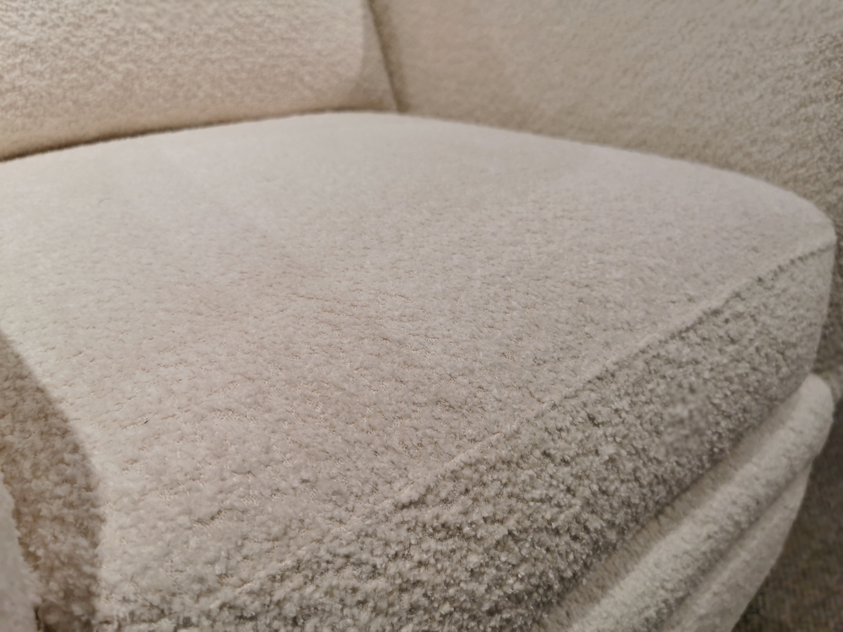 Close-up of a textured Felicity Ivory sofa cushion, highlighting the detailed upholstery fabric that pairs beautifully with any Trendline 312 Swivel Chair measuring 32" x 36" x 36".