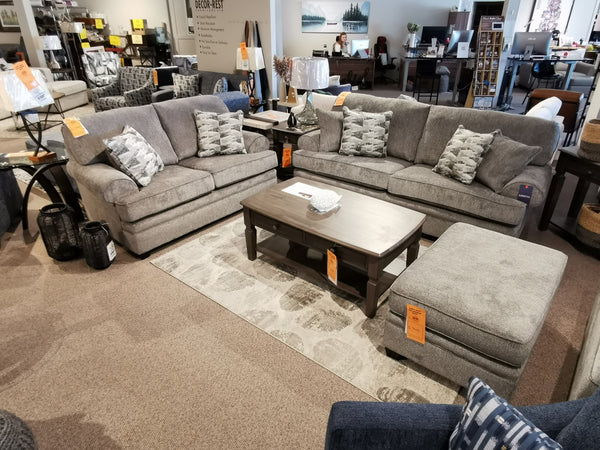 Living room display with a Trendline 4610 Sofa, coffee table, patterned cushions, and a beige carpet. Made in Canada.