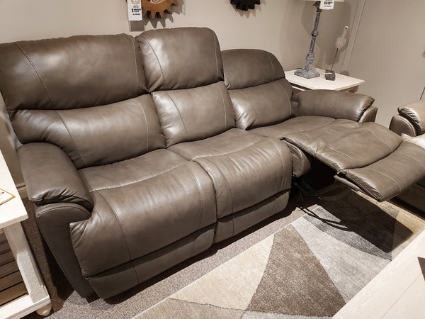 La-Z-Boy 724 Trouper leather reclining sofa with sculpted bucket seats and one extended, showcased in a showroom.