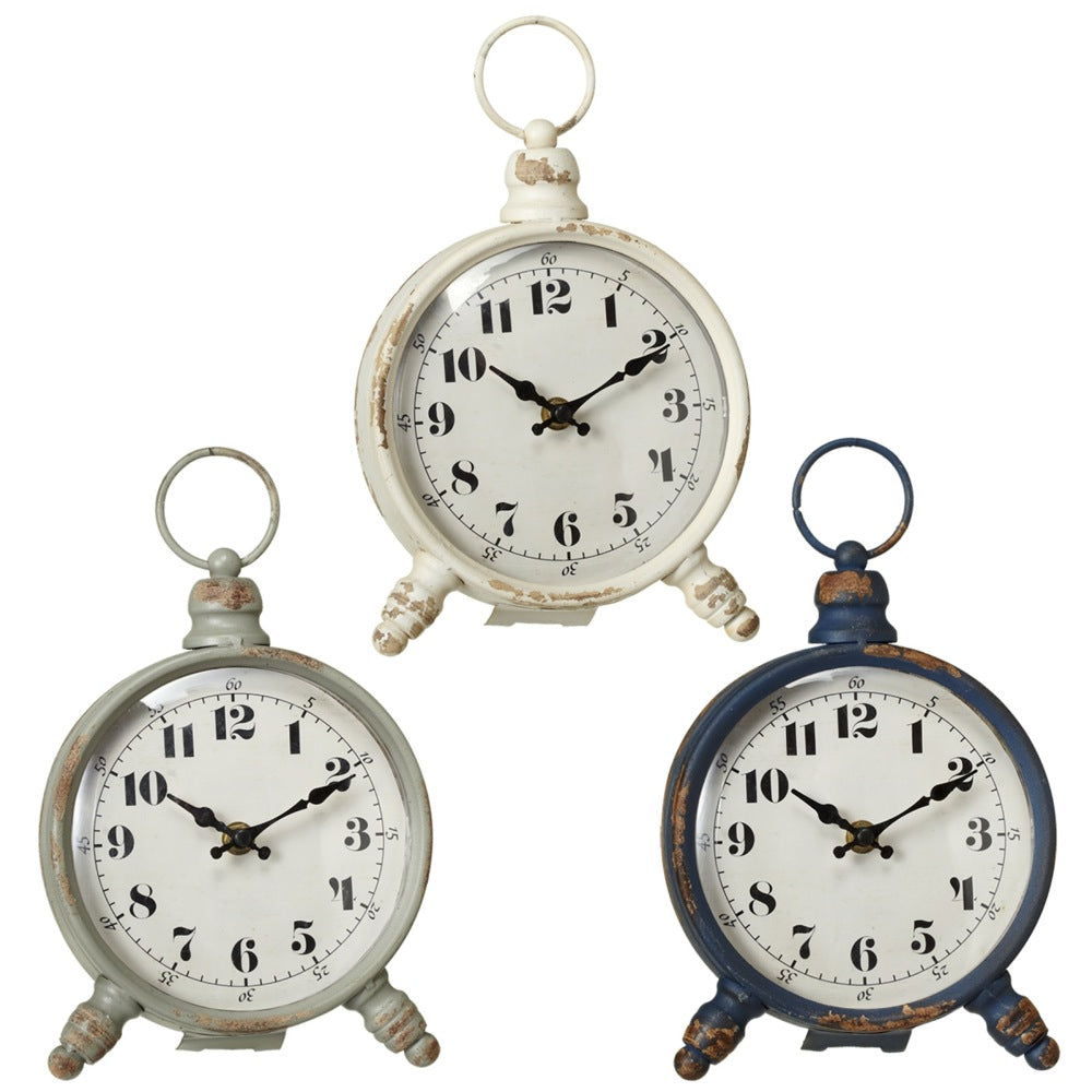 The Midwest Round Desk Clock, available in vintage-style finishes of white, grey, and navy blue, adds a touch of charm to any workspace with its distressed look.