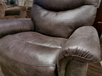 Close-up of a dark brown 521 James Rocker Recliner by La-z-boy, highlighting its bucket style seat with padded armrests and a cushioned backrest.