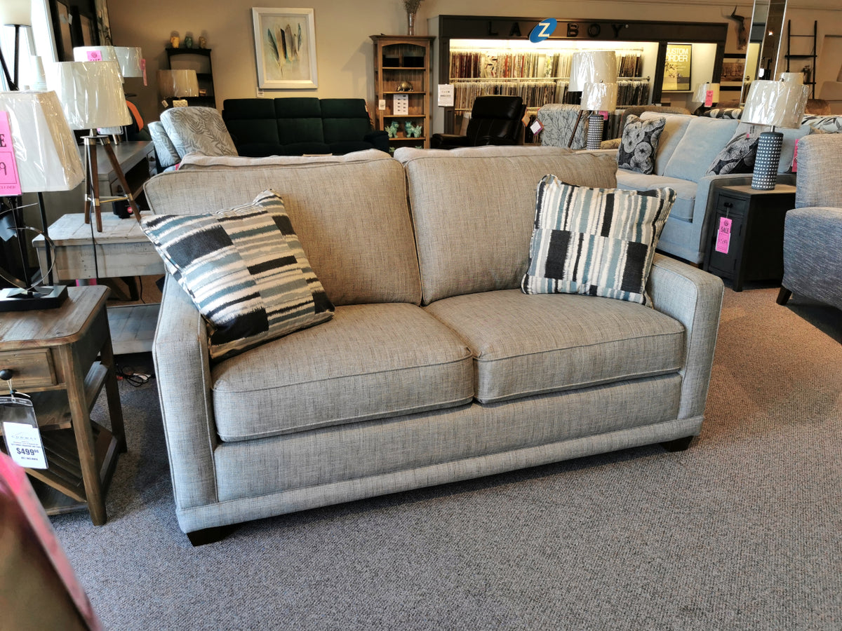 The La-Z-Boy 593 Kennedy Double Sofabed offers customizable fabrics and ComfortCore® cushions, showcased with pillows.