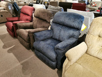 Find comfort in the showroom with a row of La-z-boy 704 Reed Wall-A-Way Recliners on display in various colors.