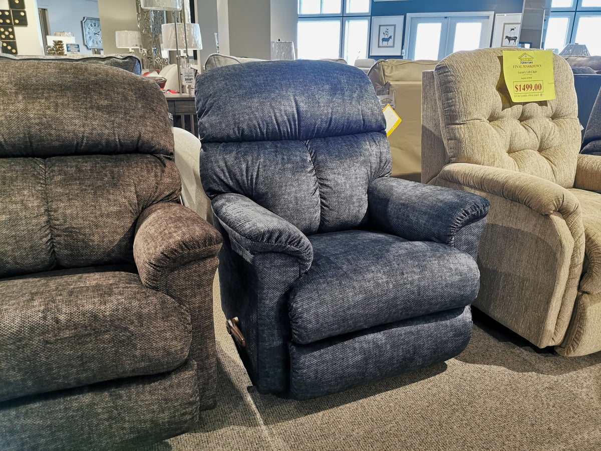 Three La-Z-Boy 704 Reed Wall-A-Way Recliners with ultra-plush padding displayed in a furniture store.