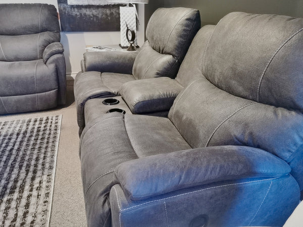 The La-Z-Boy 724 Trouper Reclining Loveseat with Console, featuring bucket seats and a handy middle console for cup holders, pairs perfectly with a matching single recliner in the cozy, carpeted living room.