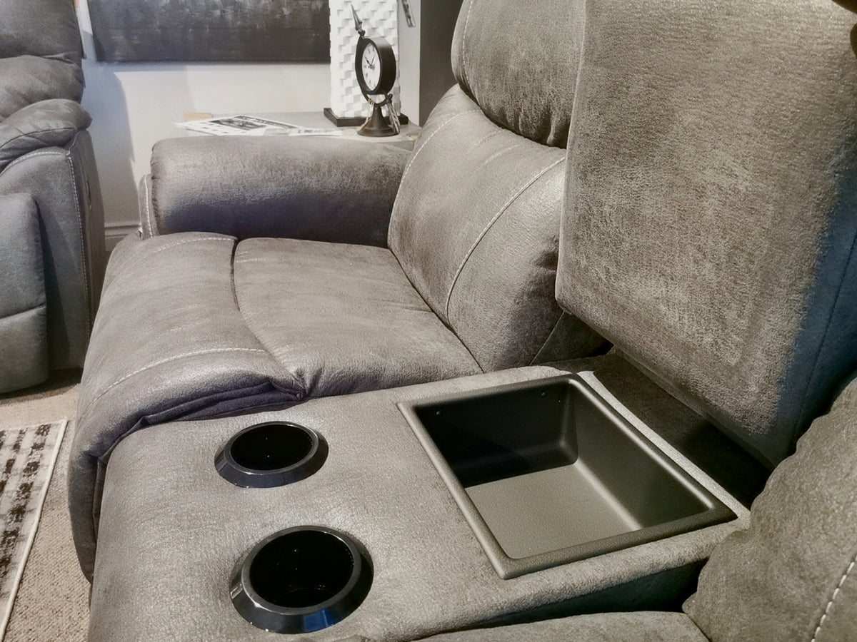 Close-up of the La-Z-Boy 724 Trouper Reclining Loveseat, showcasing its gray upholstery, bucket seats, cup holders, and a convenient center console for additional storage.