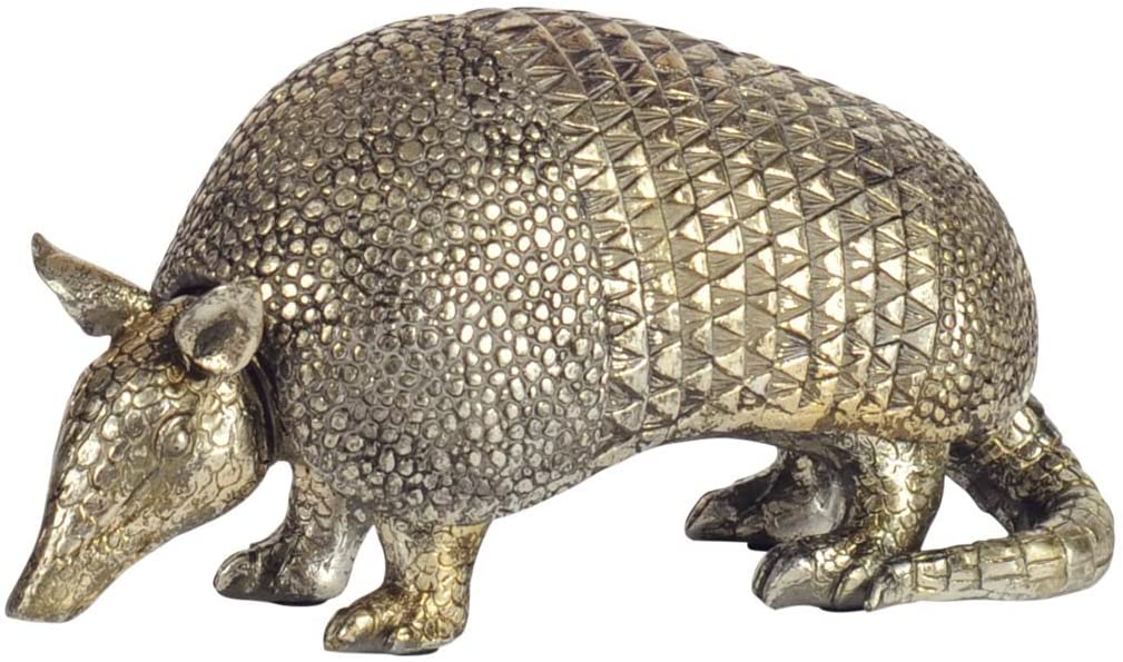 The 57807 Barclay II by Mercana is a decorative bronze statuette of a metallic armadillo, featuring a textured, patterned shell with its head tilted downward. Its detailed tail adds authenticity, while the removable shell provides hidden storage for small treasures, making it both beautiful and practical.