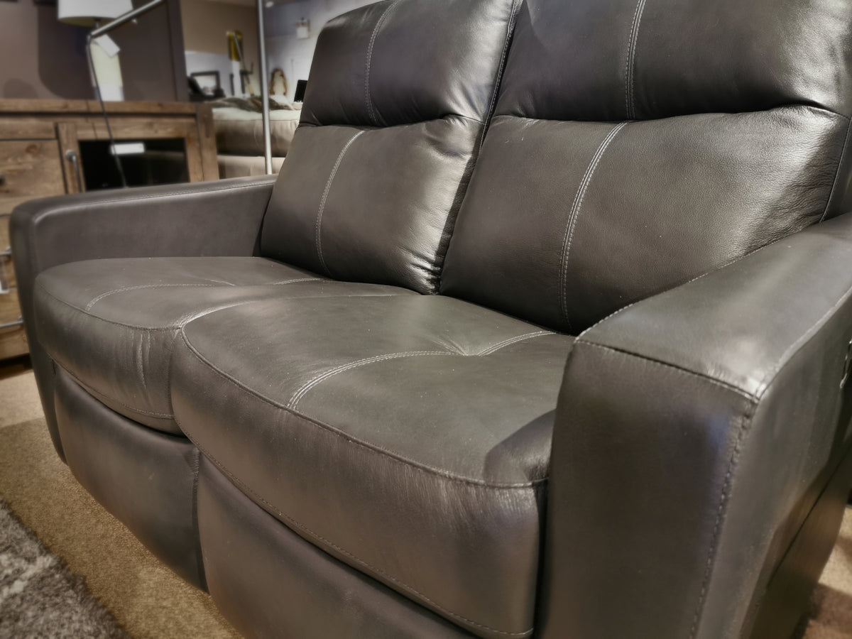 The Palliser 40132 Cairo Loveseat offers a modern black leather design with padded cushions and stitching for small spaces.