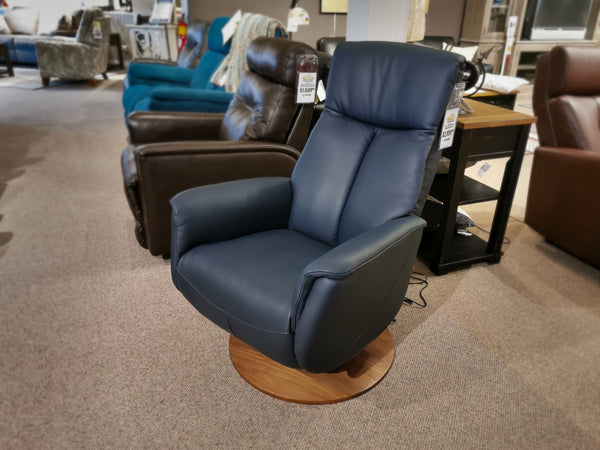 A Palliser 50030 Q30 leather swivel recliner with a circular wooden base in blue offers superior comfort.