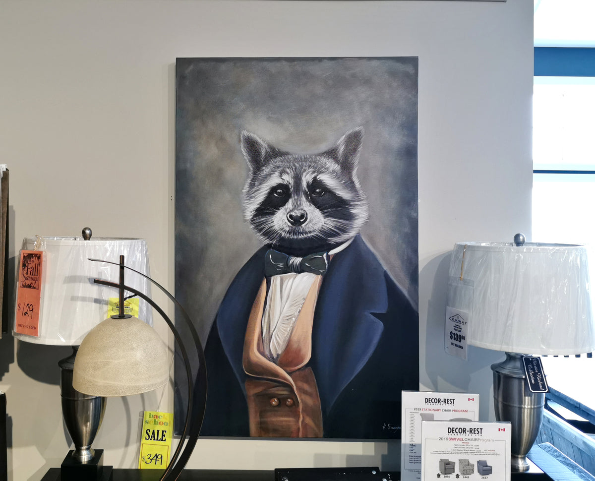 The OL1946 Tribec Print by Renwil, featuring a delightful raccoon in formal attire, graces the wall above your table. Accompanied by charming lamps and whimsical sale signs, this cute decor adds a touch of whimsy to your living space, making it both inviting and stylish.