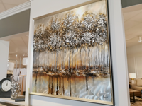 Introducing the Metallic Forest Wall Art by Renwil, which features a captivating scene of a forest with reflective water. The depth of color enhances the tall trees adorned with white foliage, creating a majestic and striking addition to any room.