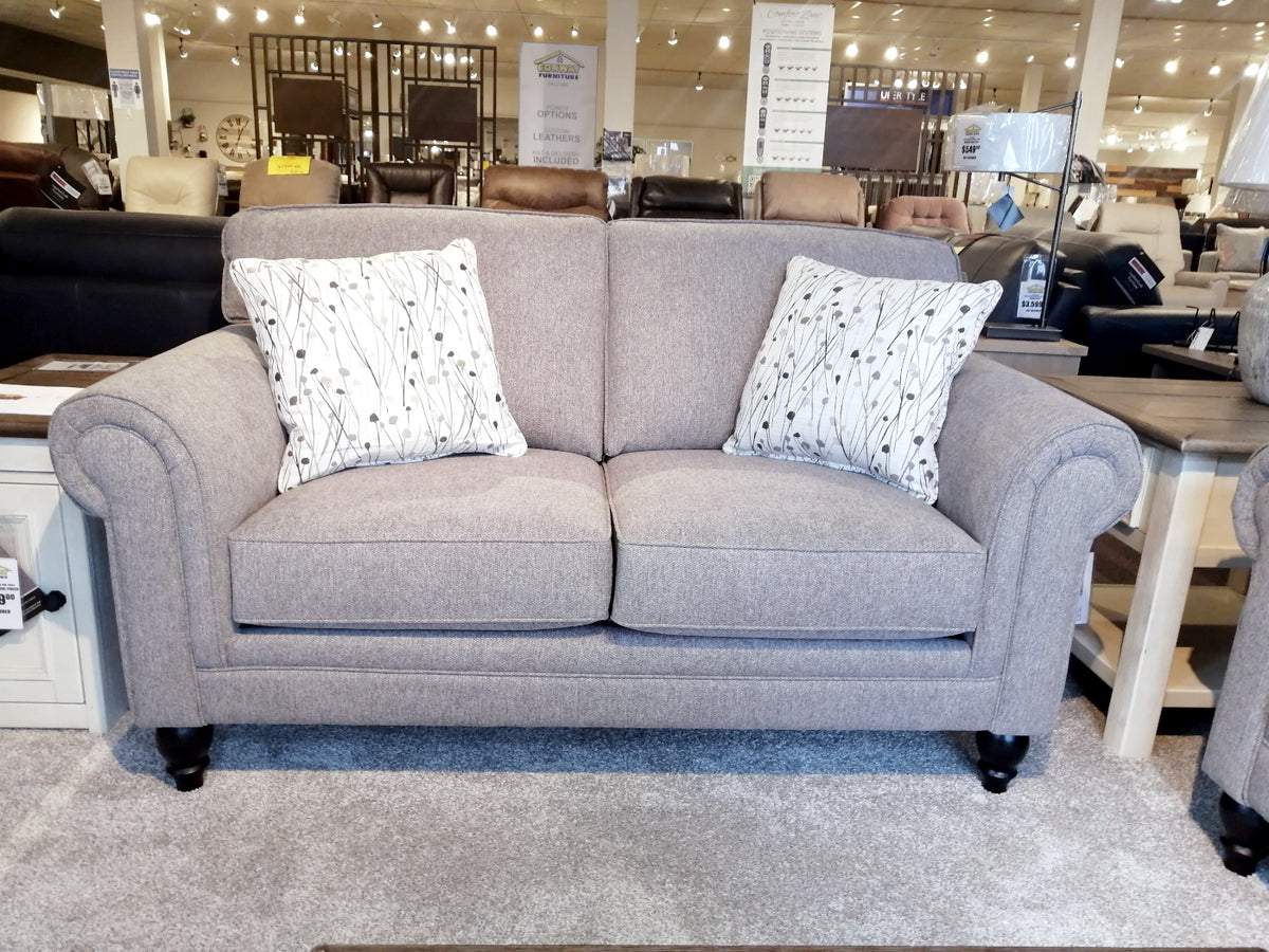 Superstyle's 9613 Loveseat: Gray upholstery, premium foam, & 2 patterned white cushions displayed with other furniture.