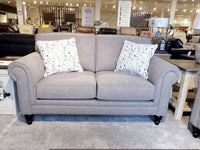 Superstyle's 9613 Loveseat: Gray upholstery, premium foam, & 2 patterned white cushions displayed with other furniture.