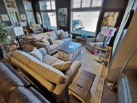 Superstyle showroom with 9613 Loveseat in beige, premium foam seating, coffee table, and decor in a well-lit space.