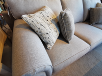 Superstyle's 9613 Loveseat with premium foam and three cushions, two gray and one patterned, in a well-lit room.