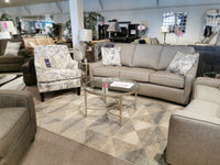 Visit our furniture showroom where the elegant charm of transitional design awaits. Explore the Superstyle 9670 Sofa set in a sophisticated gray with medium-firm seating. Pair it with a patterned armchair, a sleek glass coffee table, and a striking geometric rug, all enhanced by chic decor that perfectly captures Superstyle's distinct allure.