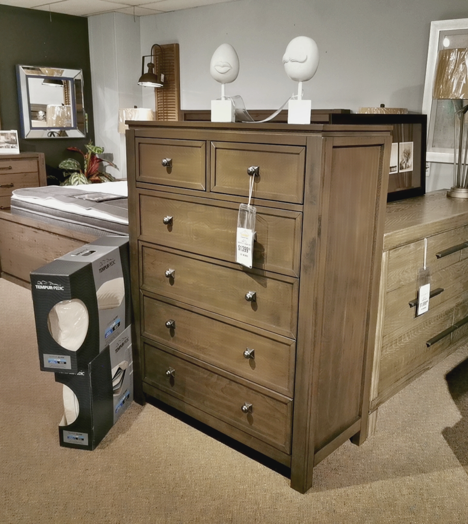 Winners Only Lancaster 6-Drawer Chest, grey/brown finish, beside a box of mattress protectors.