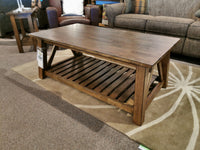 Winners Only NP100C Newport Coffee Table with solid hardwood build, slatted shelf on a patterned rug in the living room.